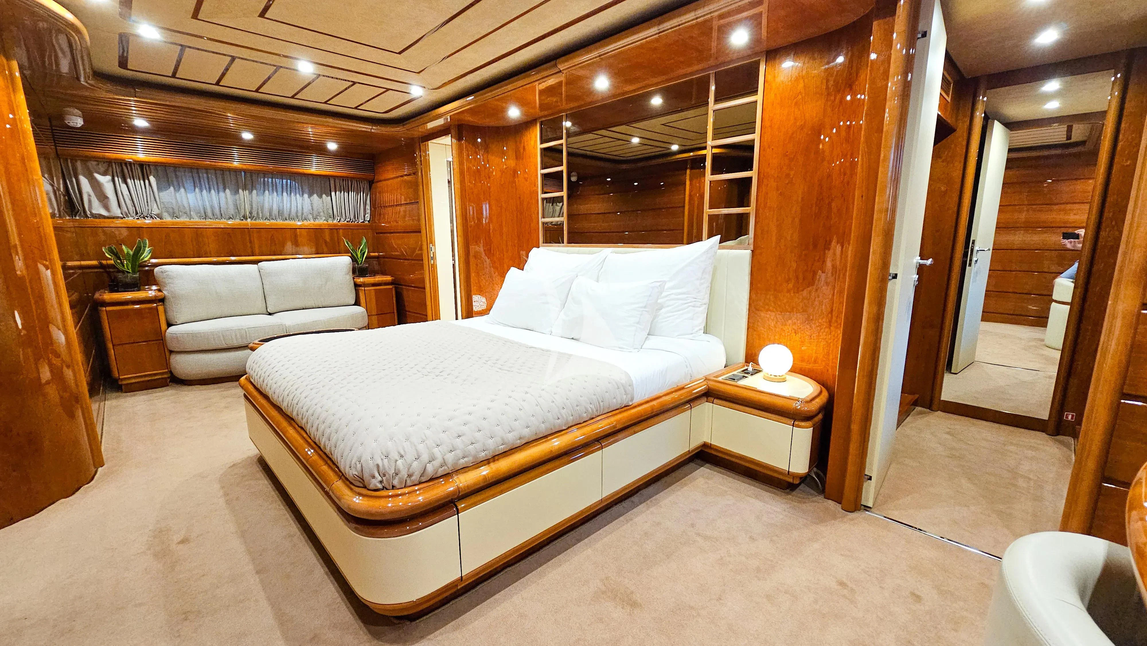a large bed in a room aboard YOLO TOO Yacht for Charter