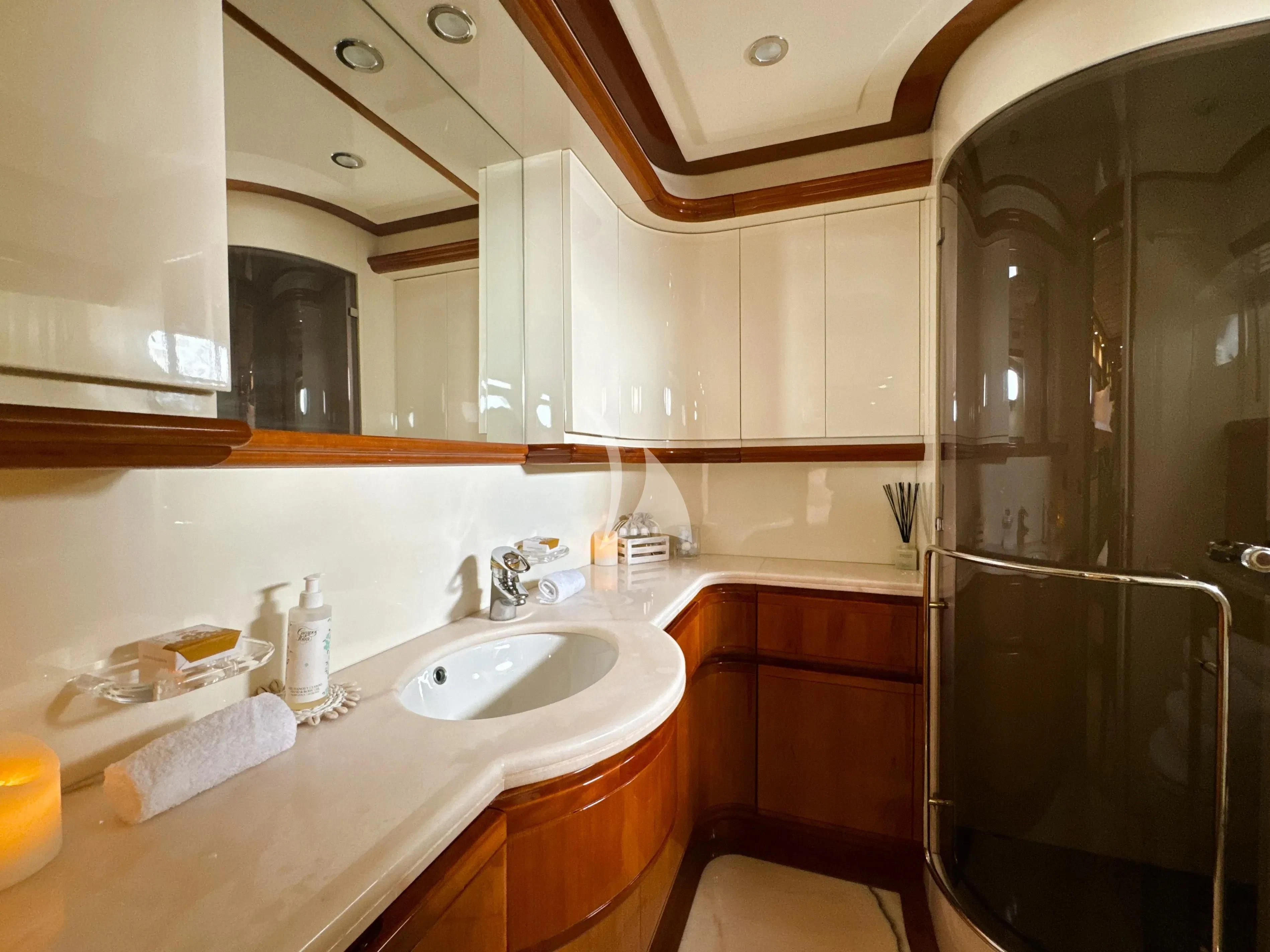 a bathroom with a sink and a mirror aboard YOLO TOO Yacht for Charter