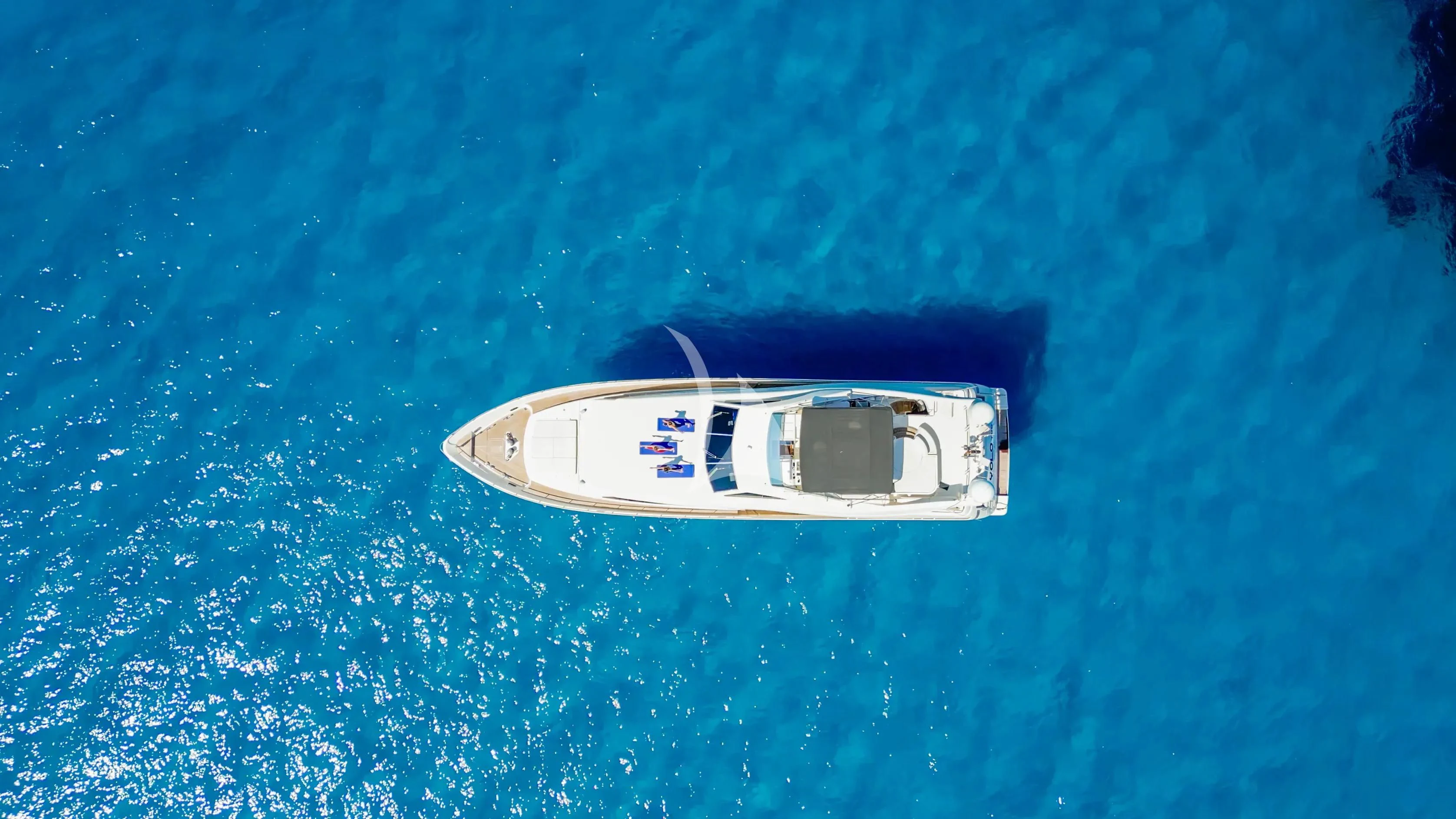 a small boat in the water aboard YOLO TOO Yacht for Charter