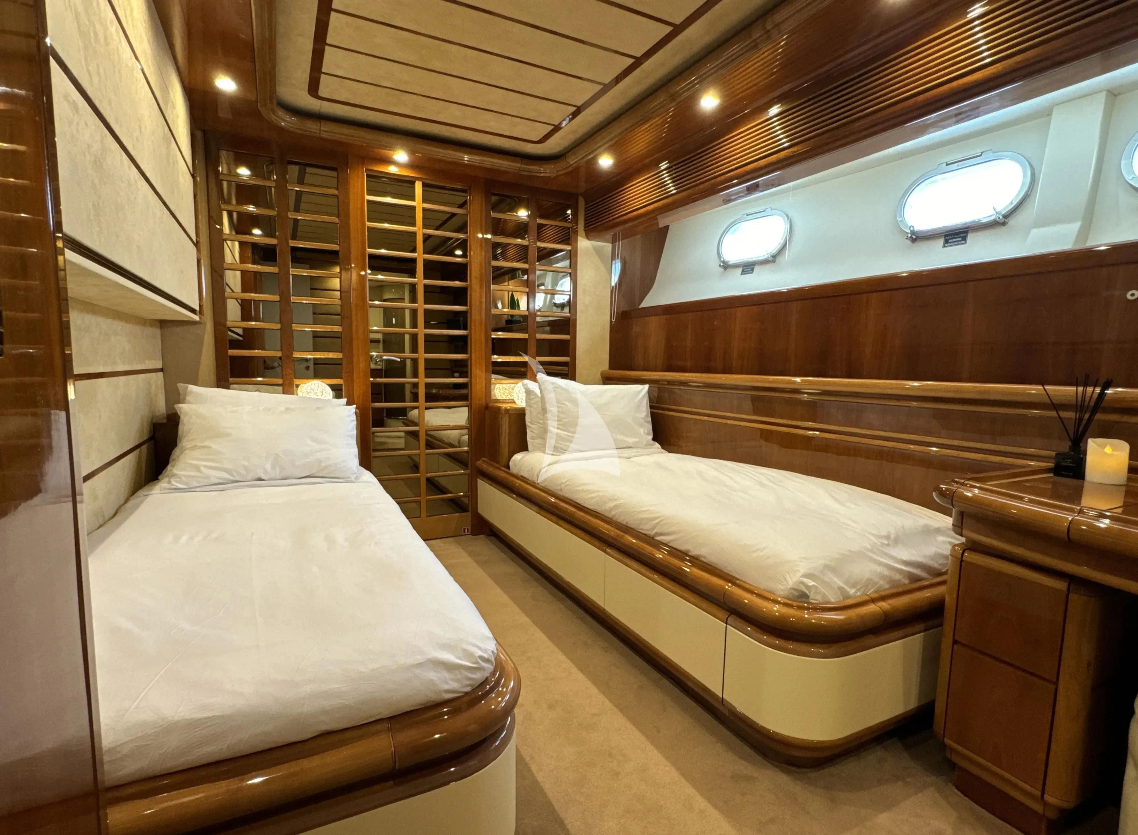 a room with two beds aboard YOLO TOO Yacht for Charter