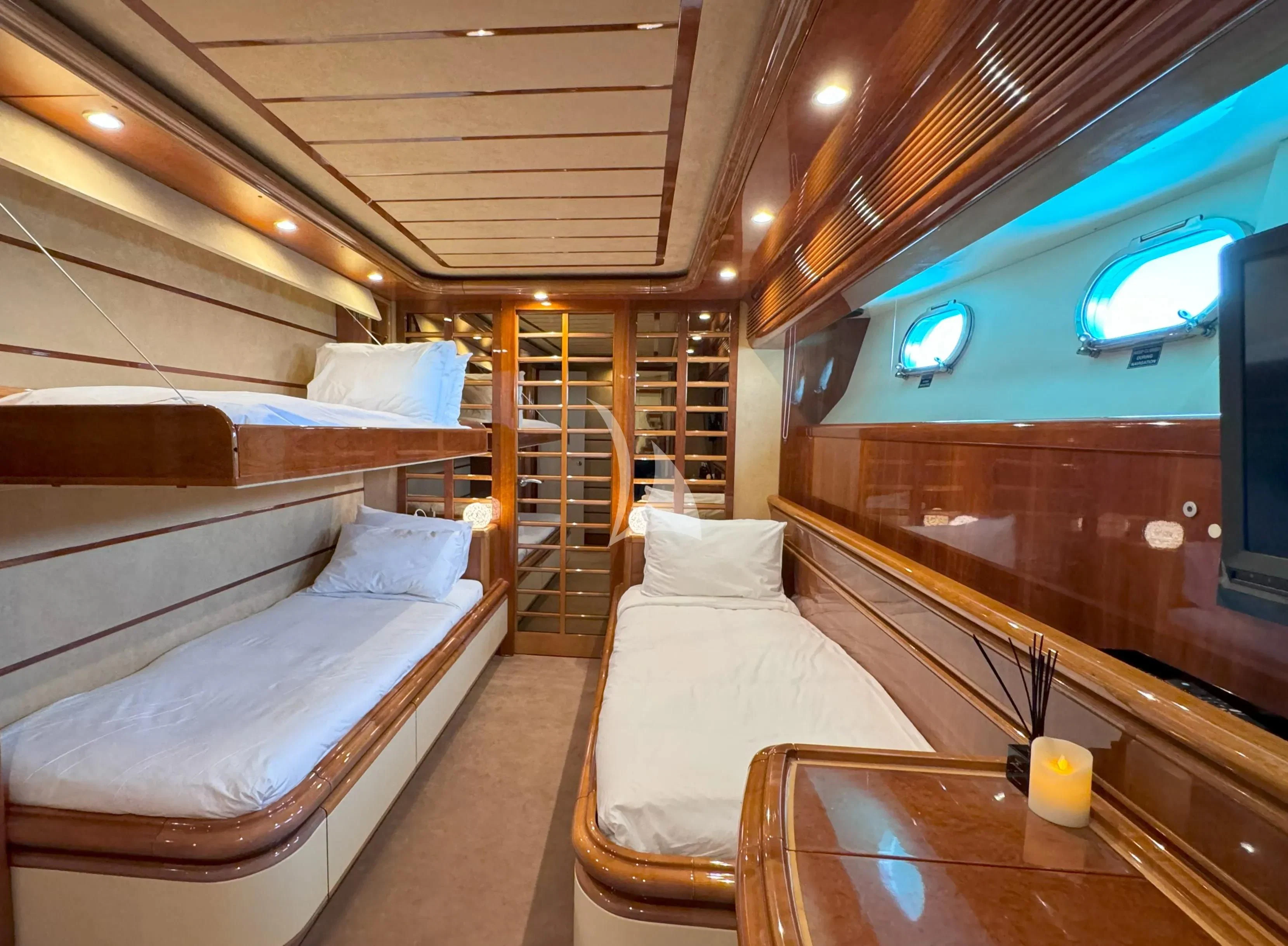 a room with a bed and a large mirror aboard YOLO TOO Yacht for Charter