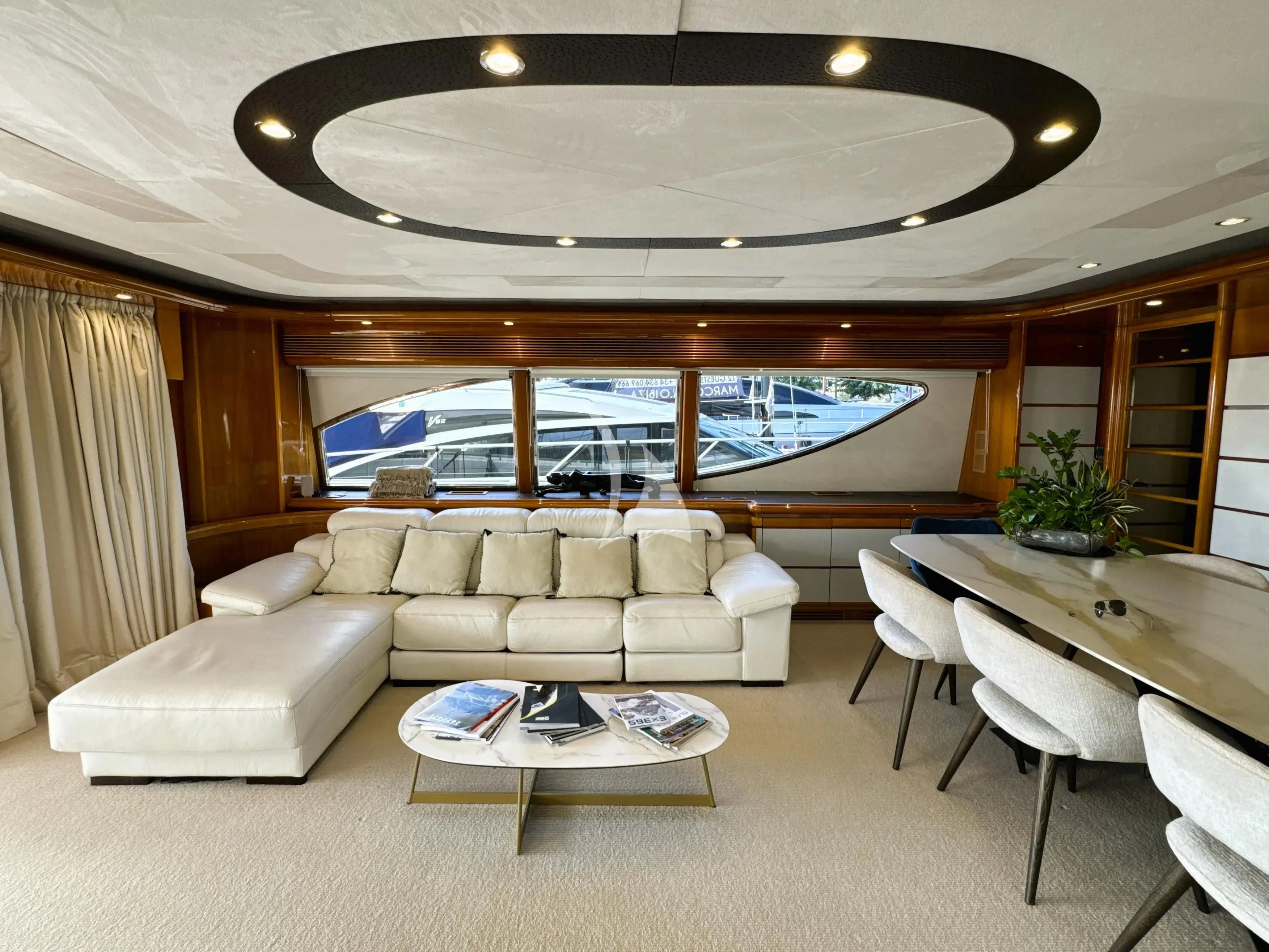 a living room with a large window aboard YOLO TOO Yacht for Charter