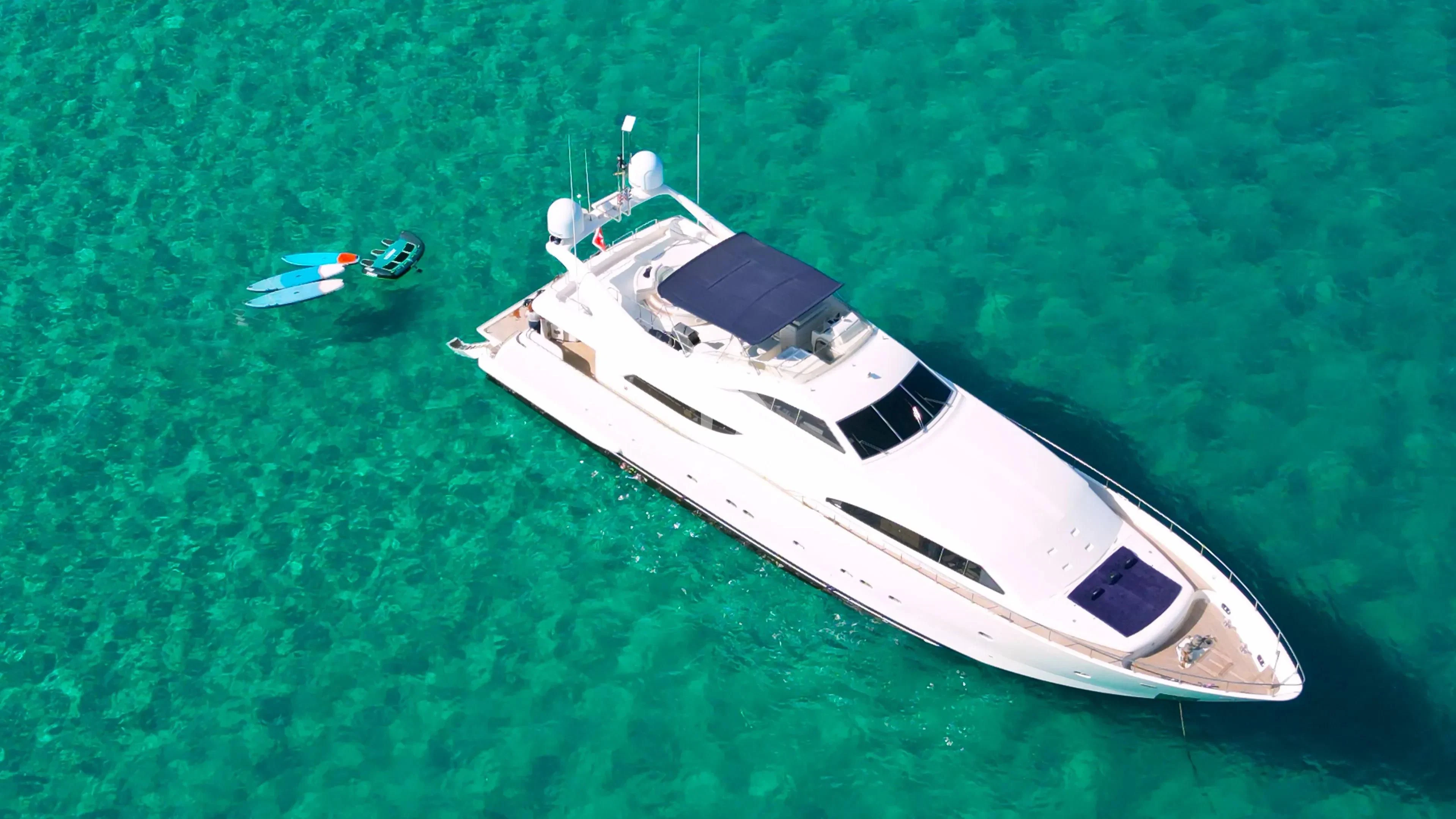 a white boat in the water aboard YOLO TOO Yacht for Charter