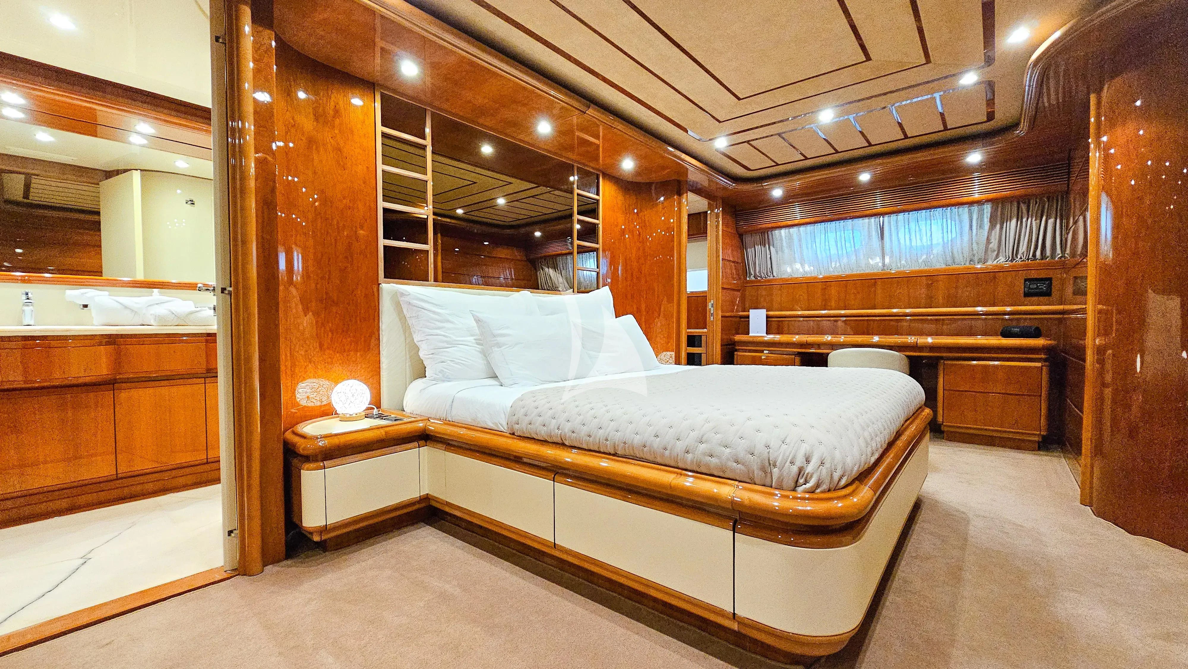 a room with a bed and a wood wall aboard YOLO TOO Yacht for Charter