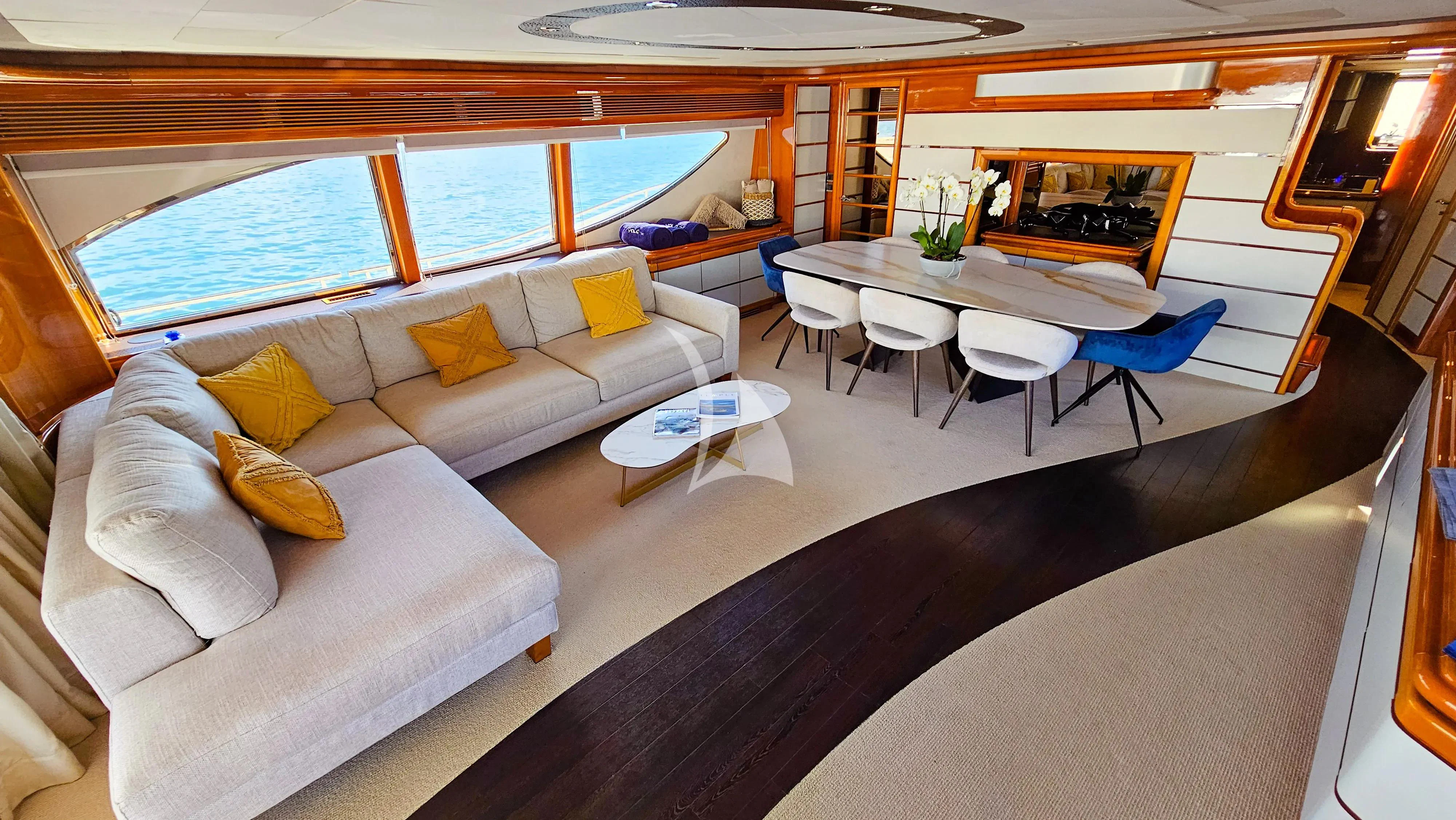 a living room with a couch and a table aboard YOLO TOO Yacht for Charter