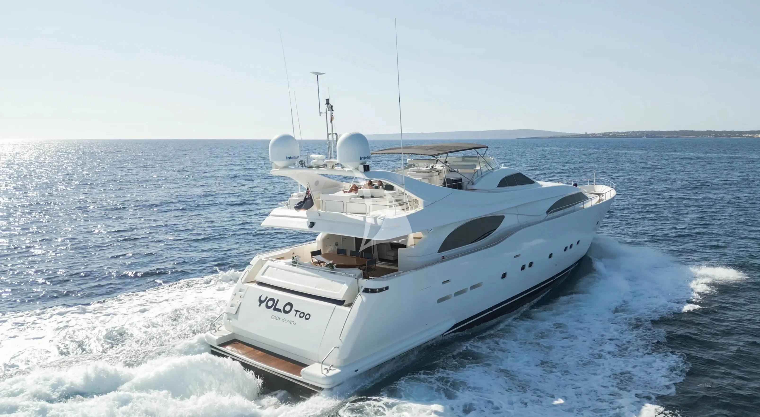 a white boat on the water aboard YOLO TOO Yacht for Charter