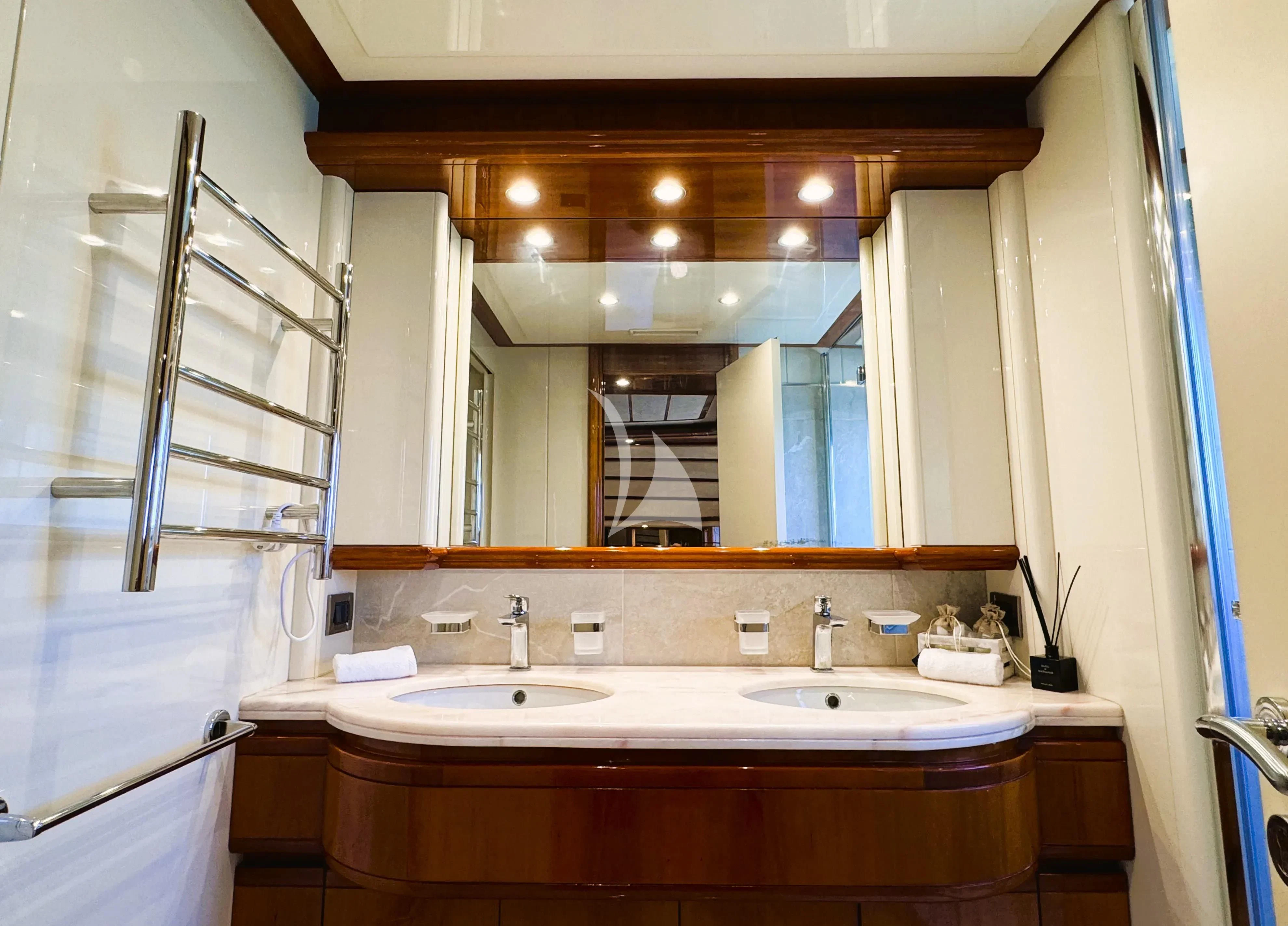 a bathroom with a large mirror aboard YOLO TOO Yacht for Charter