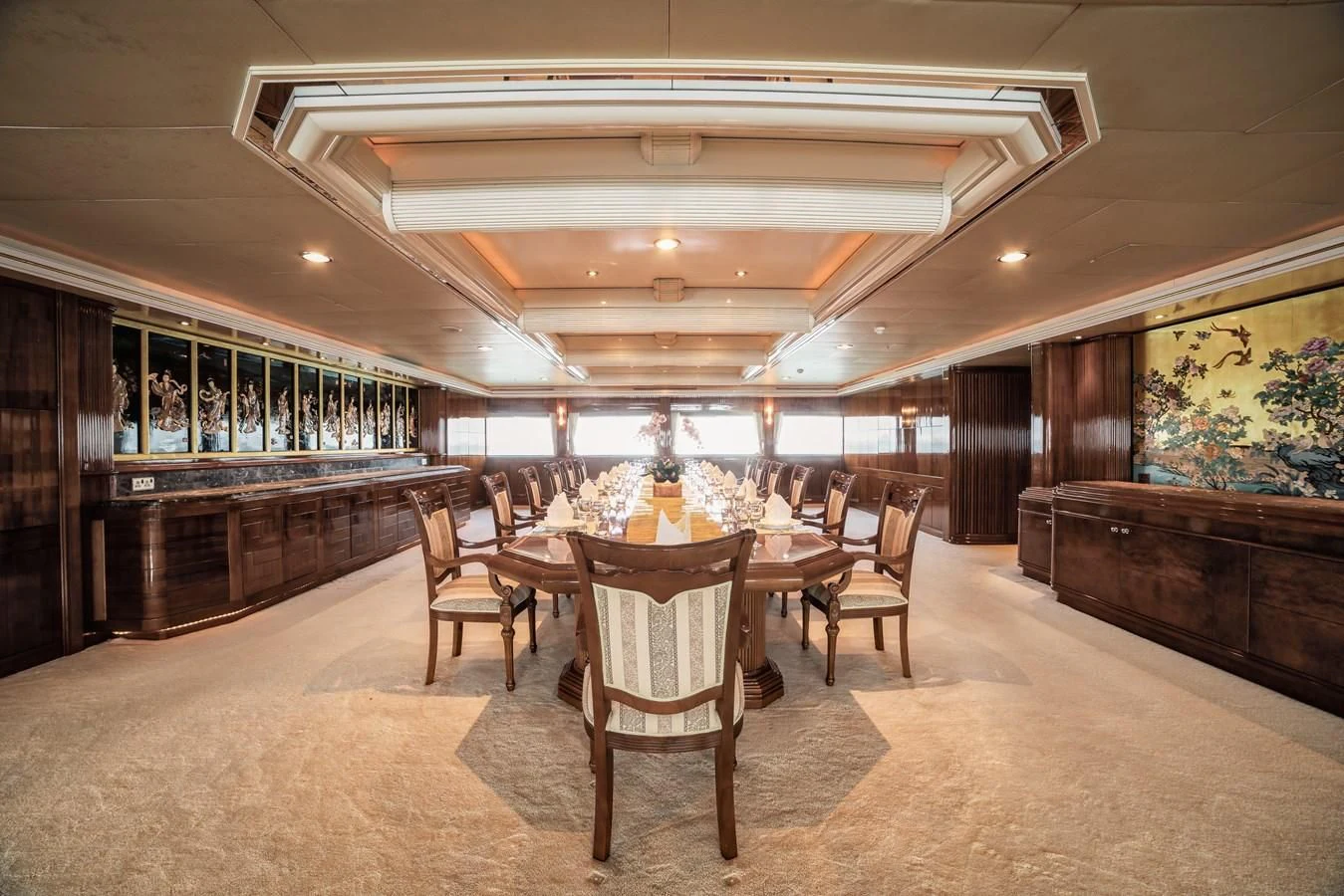 a room with a table and chairs aboard ASEAN LADY Yacht for Sale