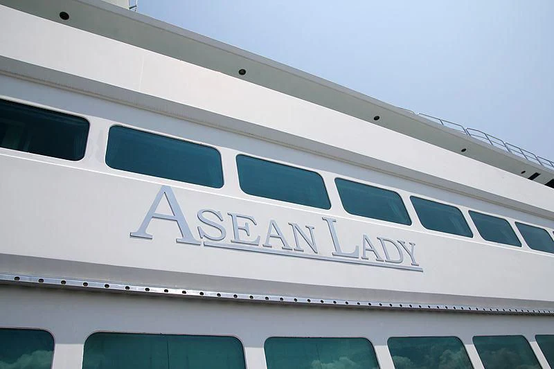 a white building with a sign aboard ASEAN LADY Yacht for Sale