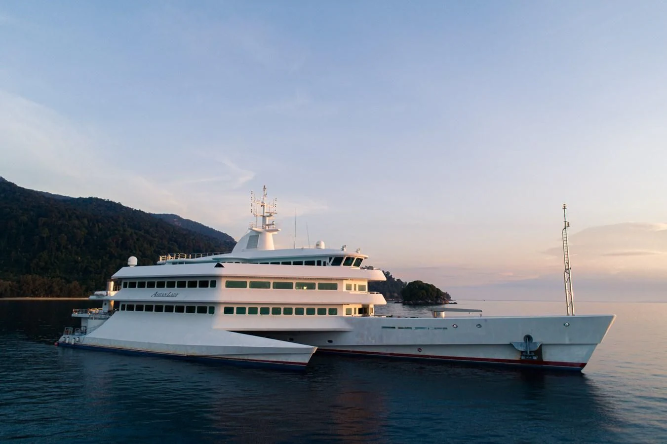 a large white boat in the water aboard ASEAN LADY Yacht for Sale