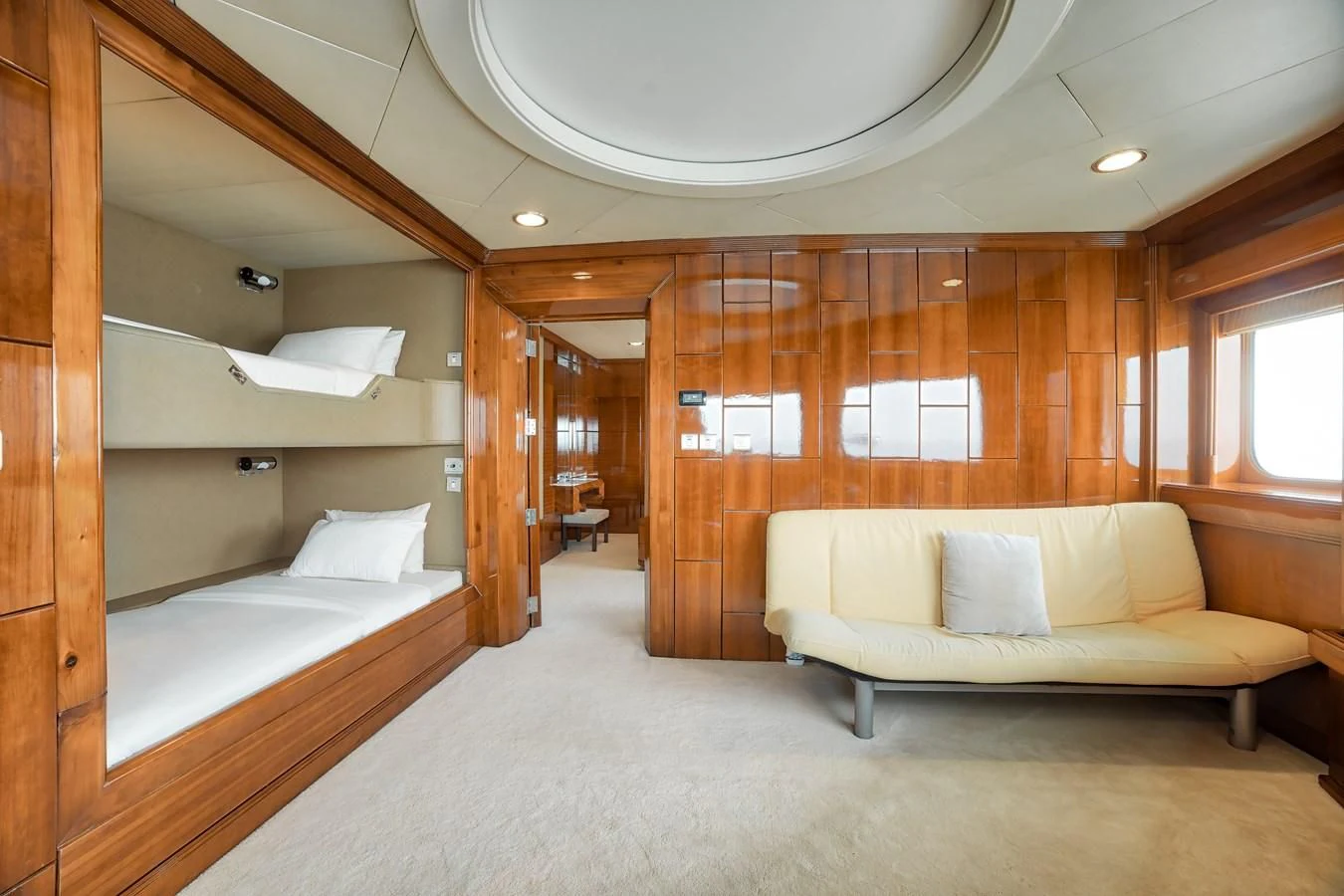 a room with a bed and a couch aboard ASEAN LADY Yacht for Sale