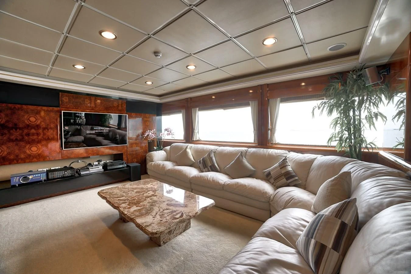 a living room with a couch and a television aboard ASEAN LADY Yacht for Sale