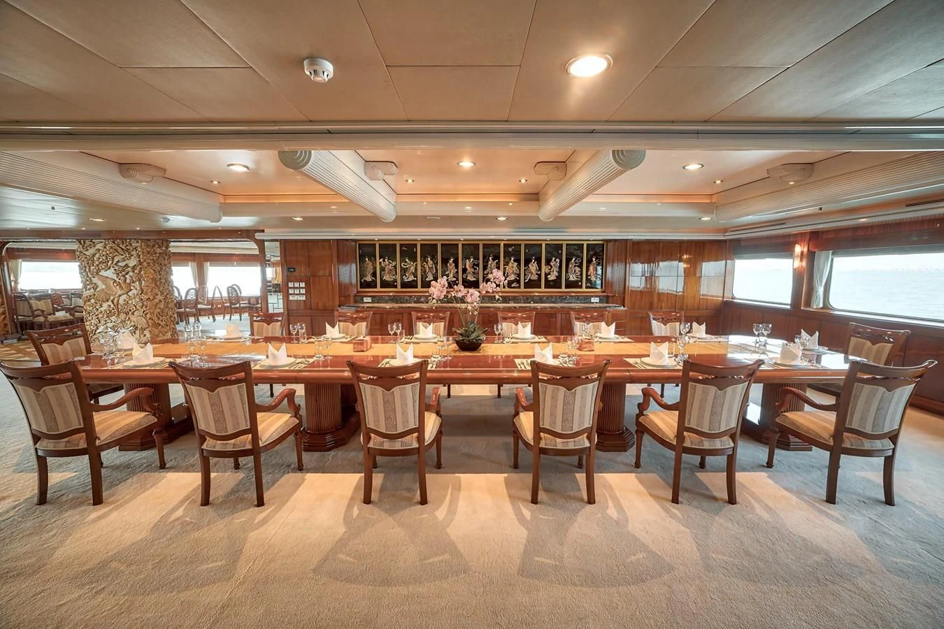 a large room with a table and chairs aboard ASEAN LADY Yacht for Sale