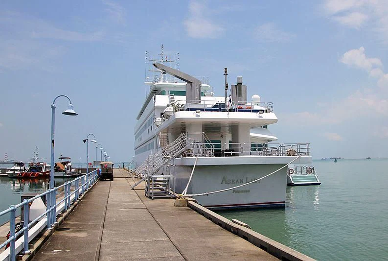 a large white boat on a body of water aboard ASEAN LADY Yacht for Sale