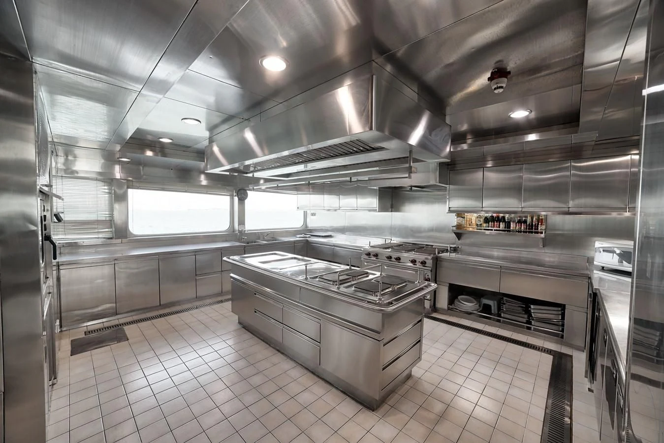 a large kitchen with stainless steel appliances aboard ASEAN LADY Yacht for Sale