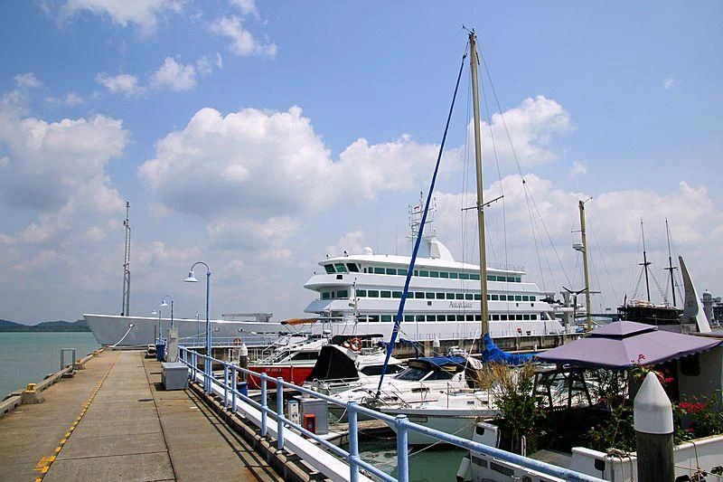 a large boat docked at a pier aboard ASEAN LADY Yacht for Sale