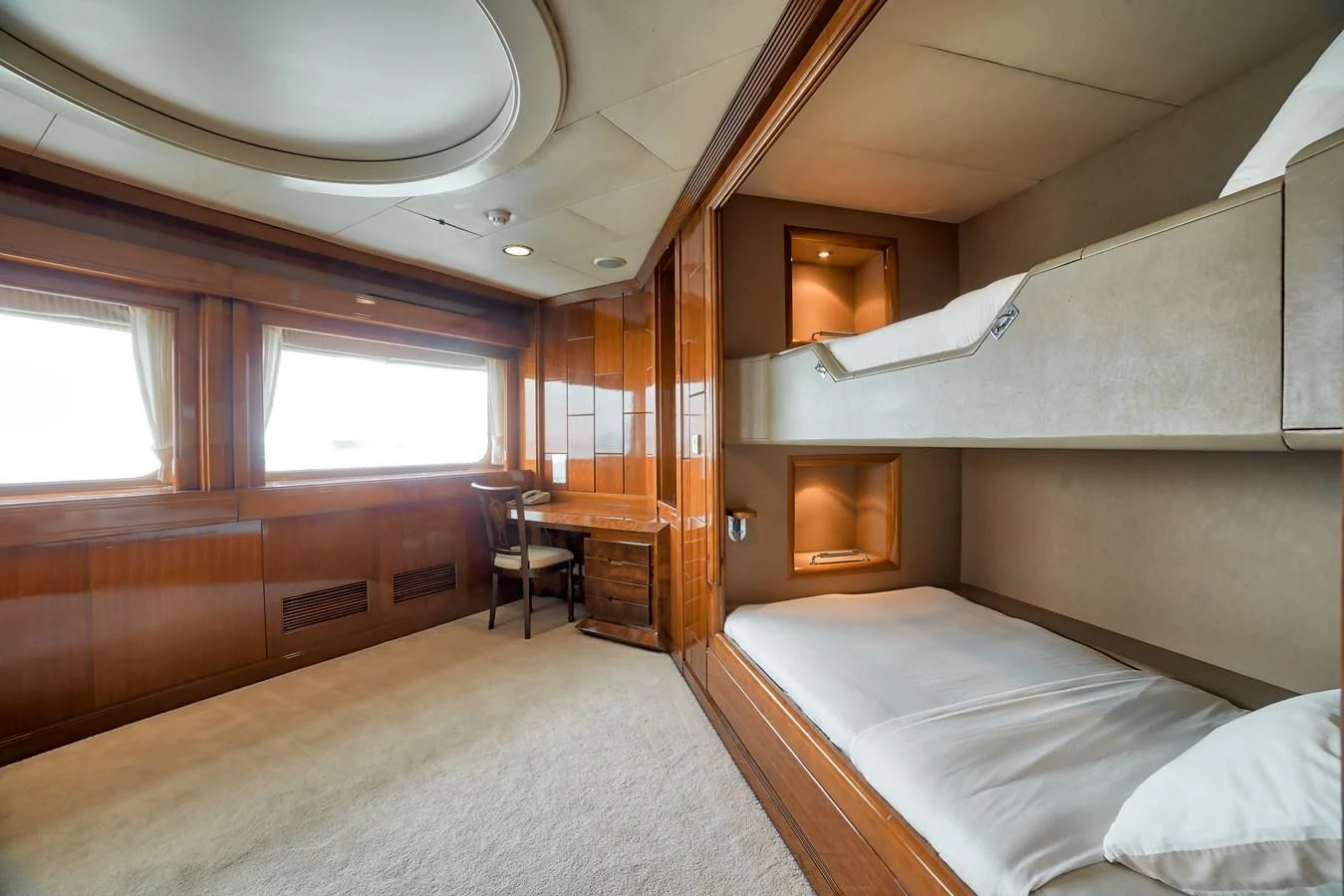 a room with a bed and a desk aboard ASEAN LADY Yacht for Sale