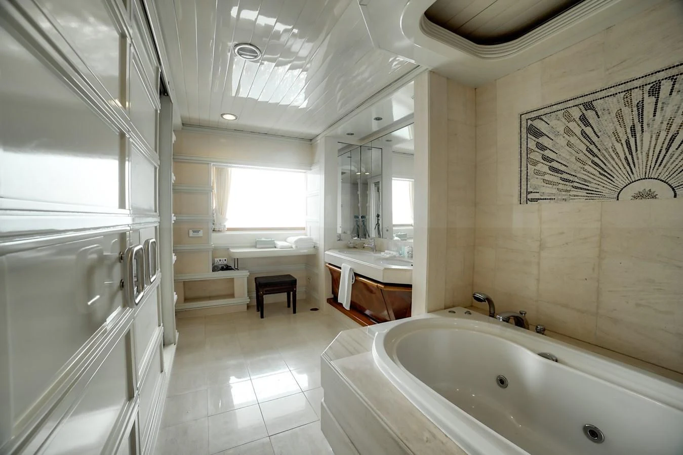 a bathroom with a tub sink and a mirror aboard ASEAN LADY Yacht for Sale