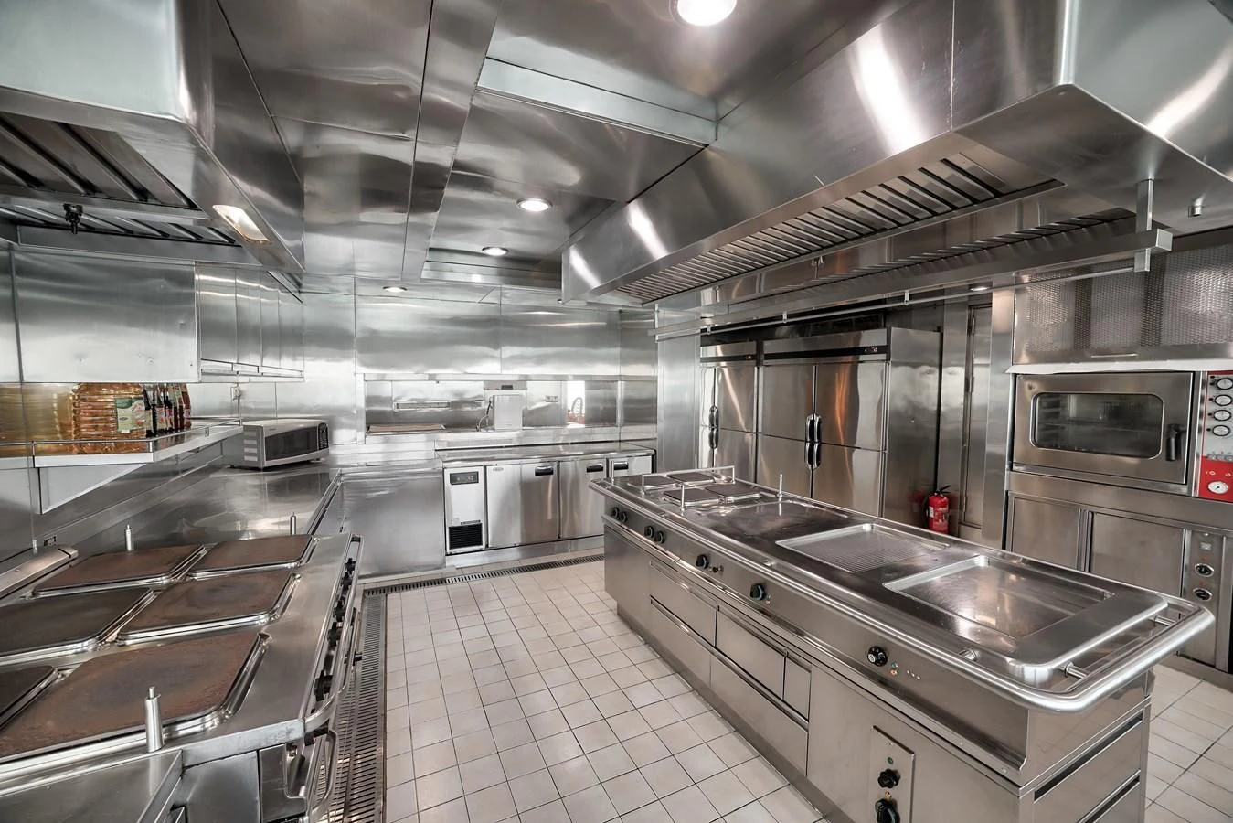 a large kitchen with stainless steel appliances aboard ASEAN LADY Yacht for Sale