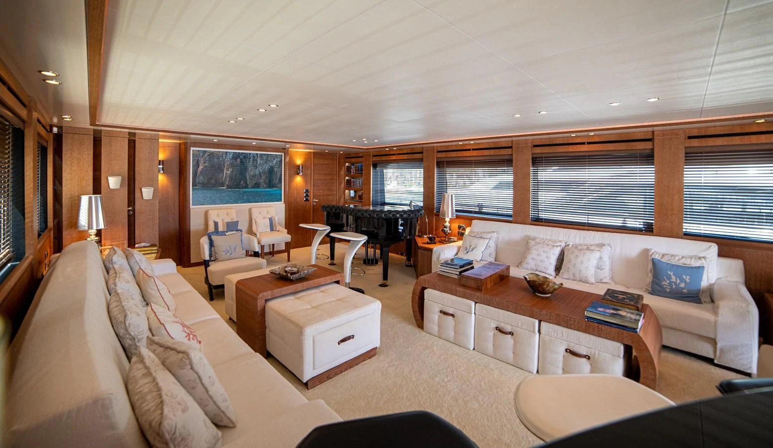 a living room with a piano and a piano aboard B TWO Yacht for Sale