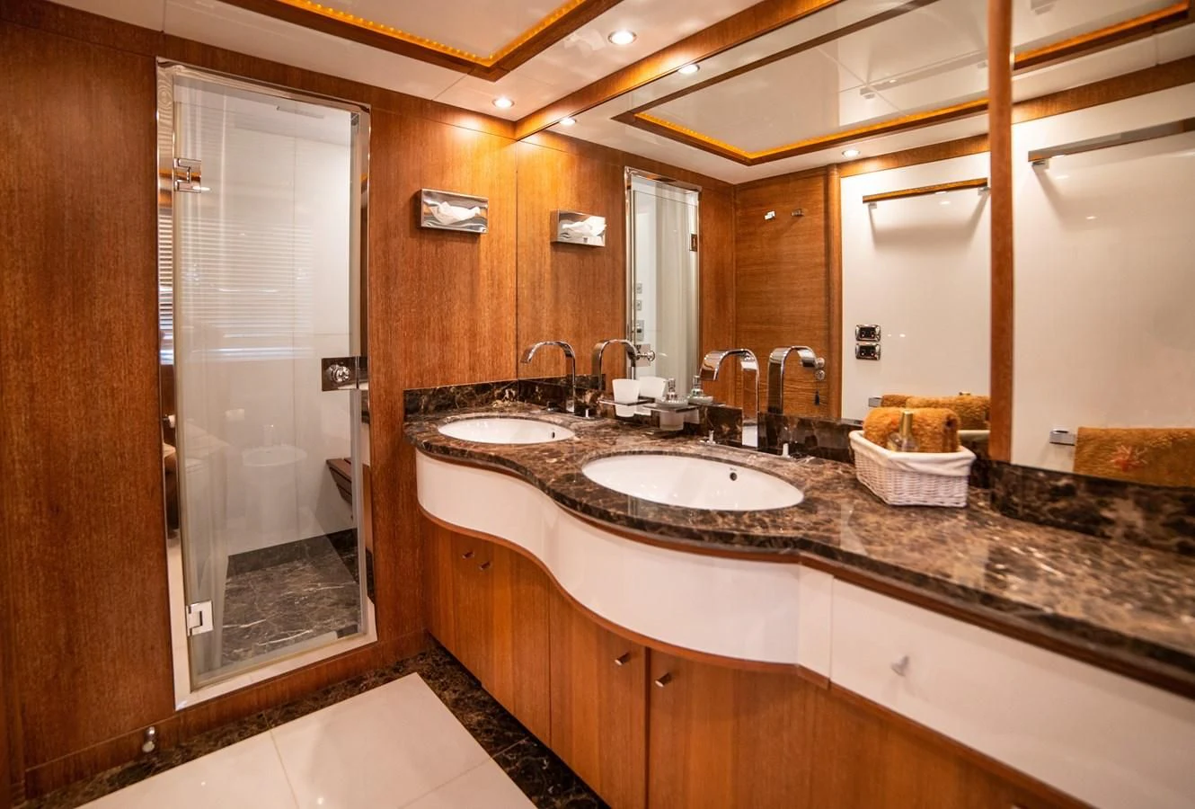 a bathroom with a large mirror aboard B TWO Yacht for Sale