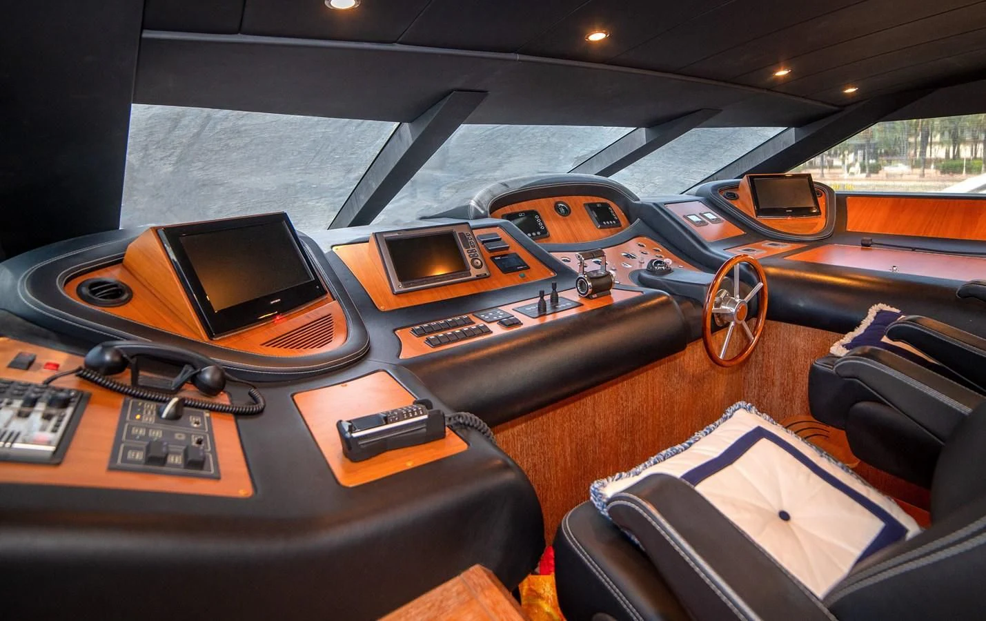 a table with electronics and a laptop aboard B TWO Yacht for Sale
