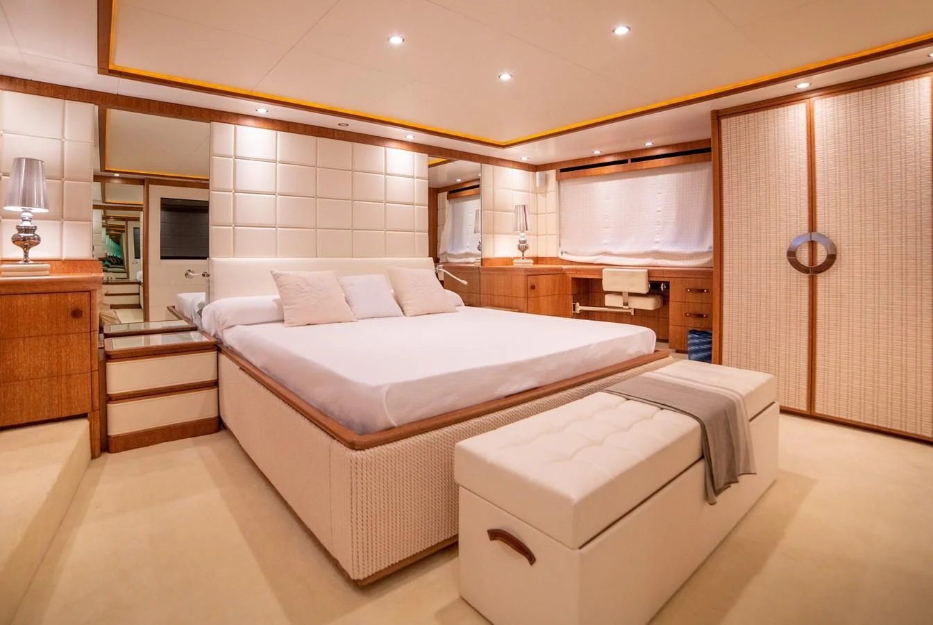 a large room with a bed and a desk aboard B TWO Yacht for Sale