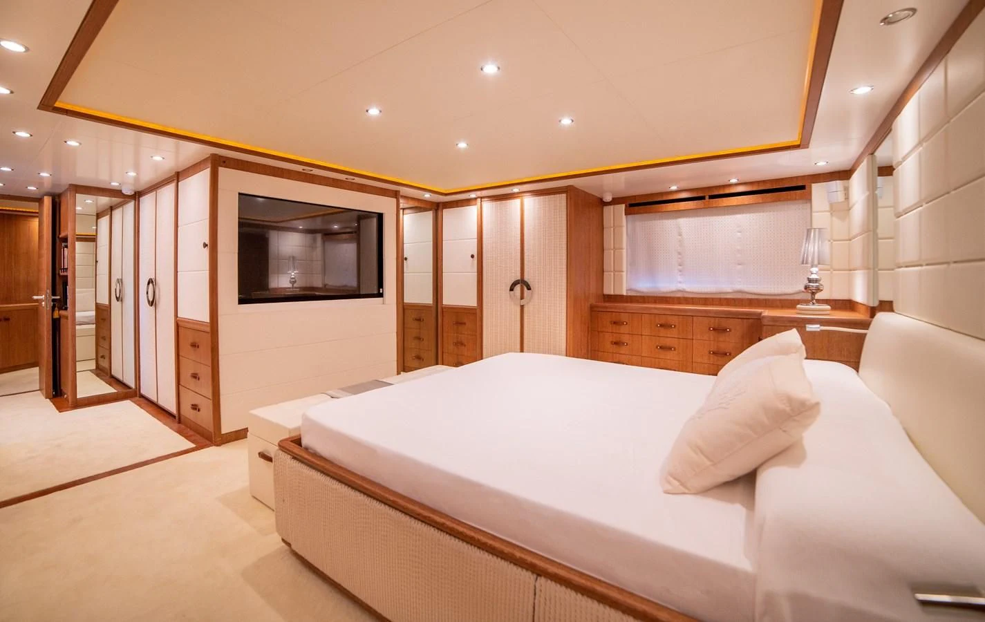 a room with a bed and a television aboard B TWO Yacht for Sale