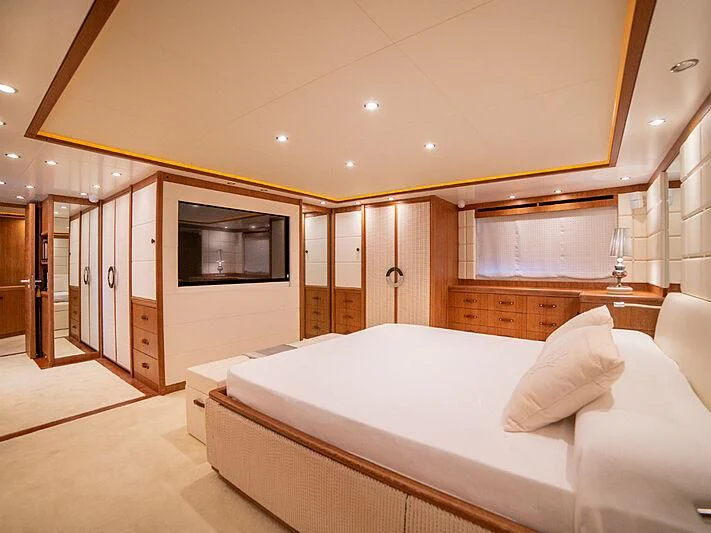 a bedroom with a bed and a television aboard B TWO Yacht for Sale