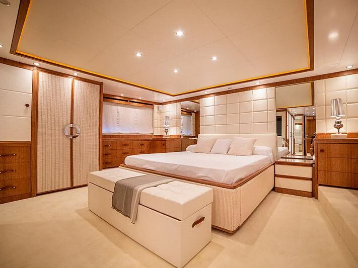a room with a bed and a mirror aboard B TWO Yacht for Sale