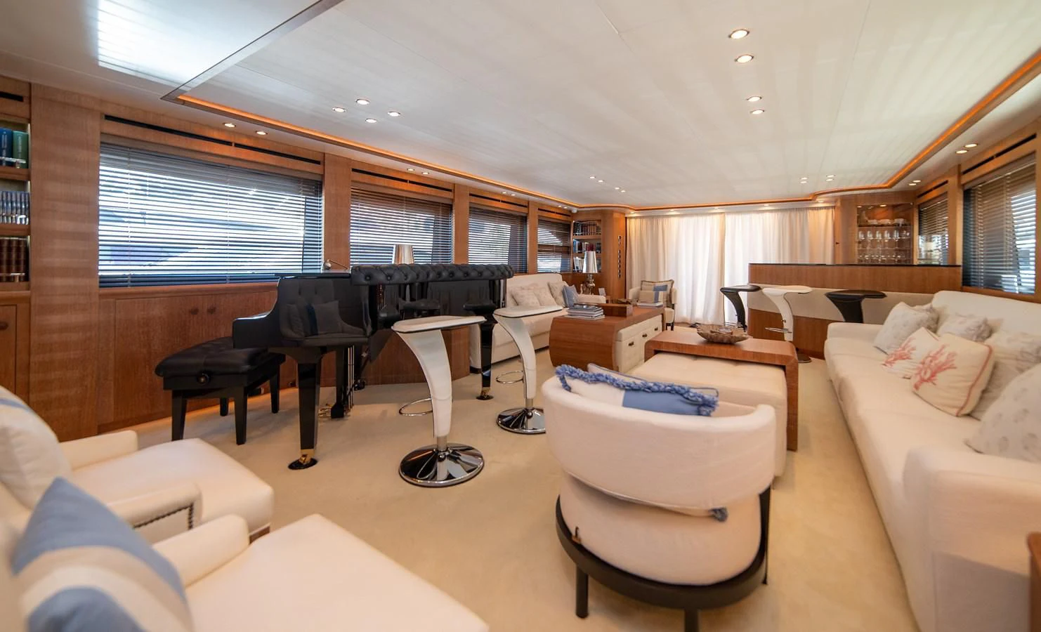 a living room with a piano and a couch aboard B TWO Yacht for Sale