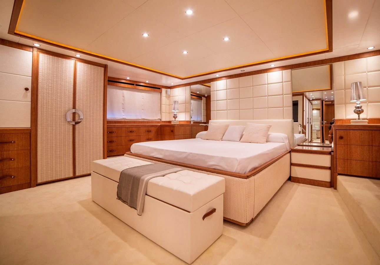 a large bedroom with a bed aboard B TWO Yacht for Sale