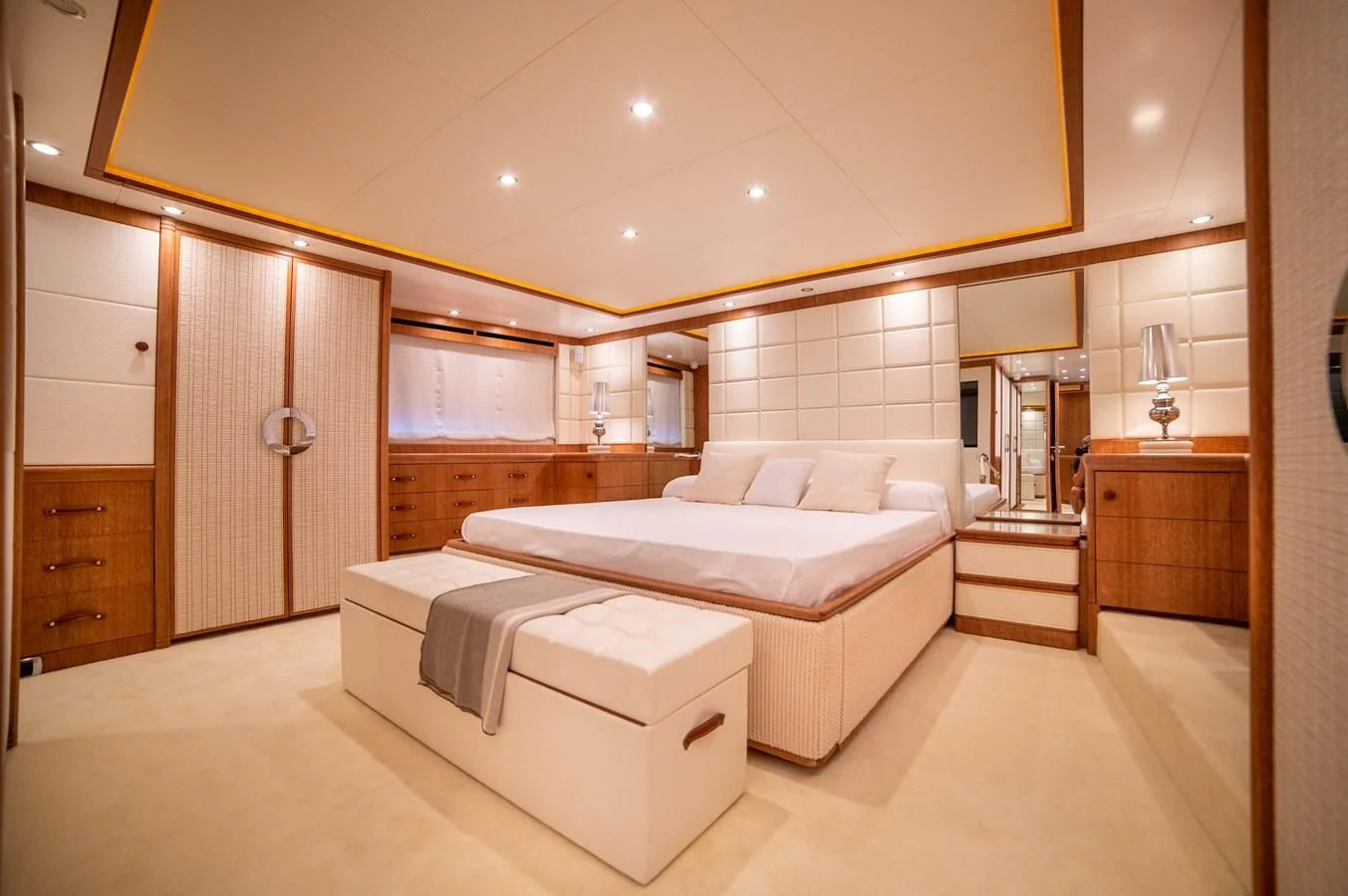 a large room with a bed and a mirror aboard B TWO Yacht for Sale