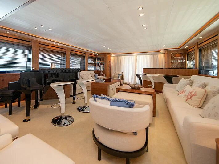 a living room with a piano and a piano aboard B TWO Yacht for Sale