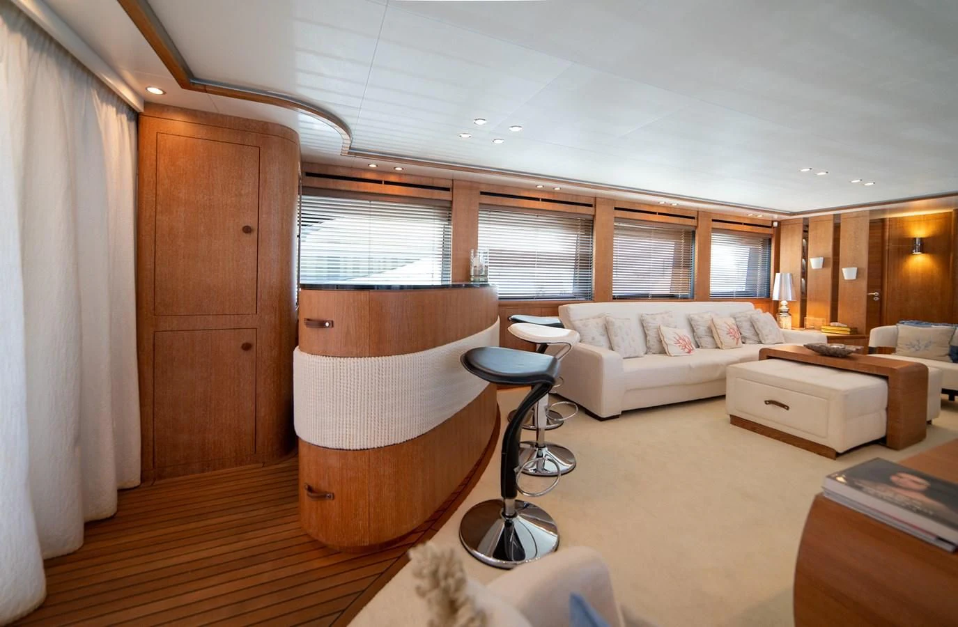 a living room with a wood floor aboard B TWO Yacht for Sale