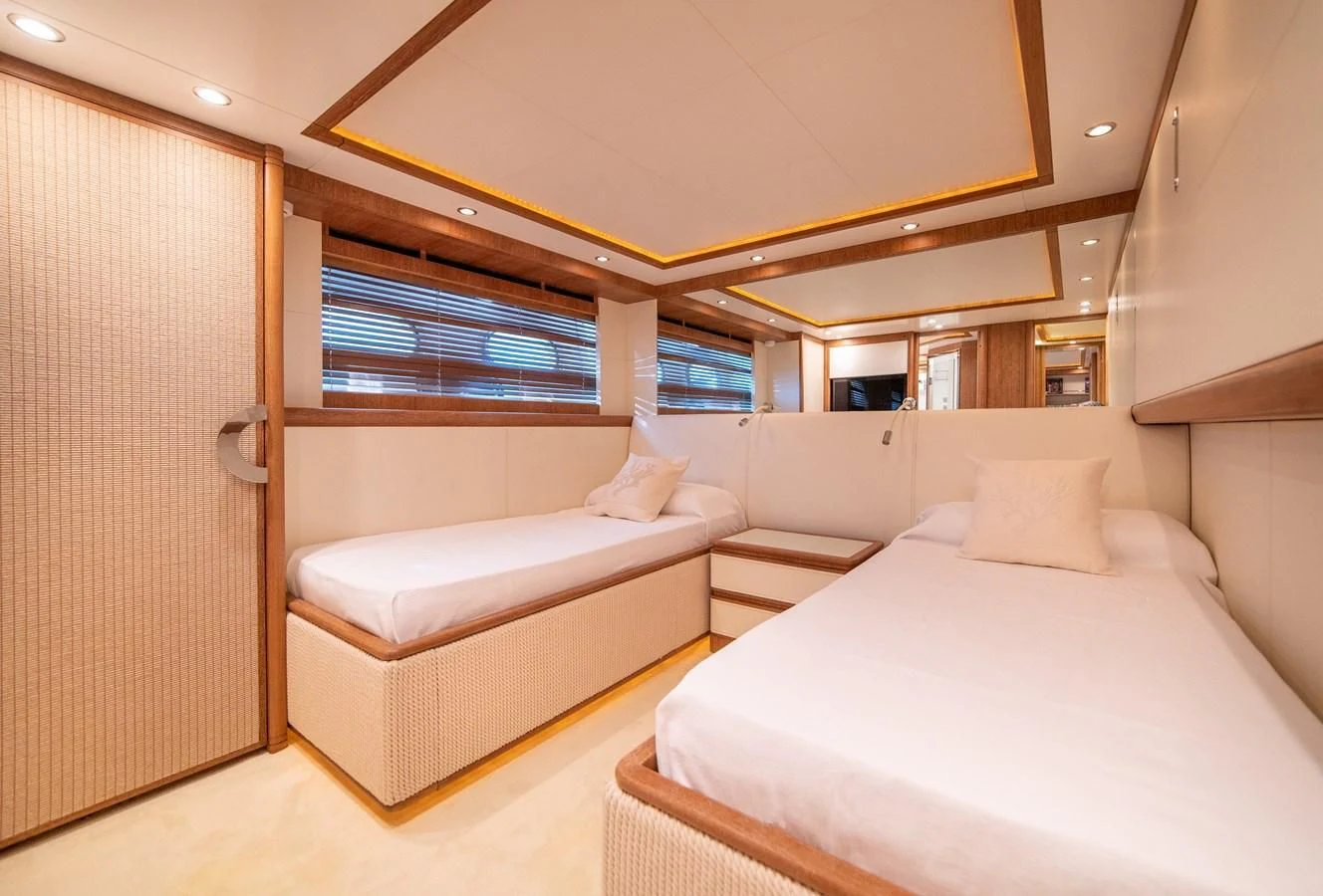 a room with a bed and a window aboard B TWO Yacht for Sale