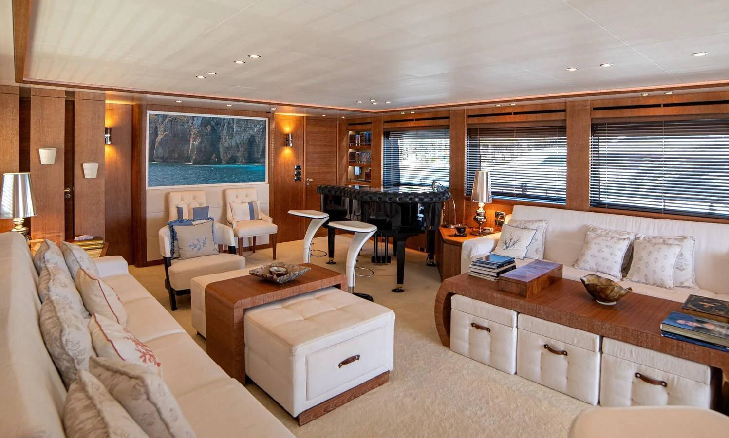 a living room with a piano and a piano aboard B TWO Yacht for Sale