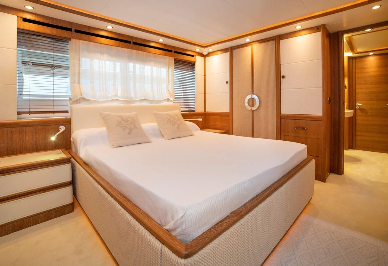 a bed in a room aboard B TWO Yacht for Sale