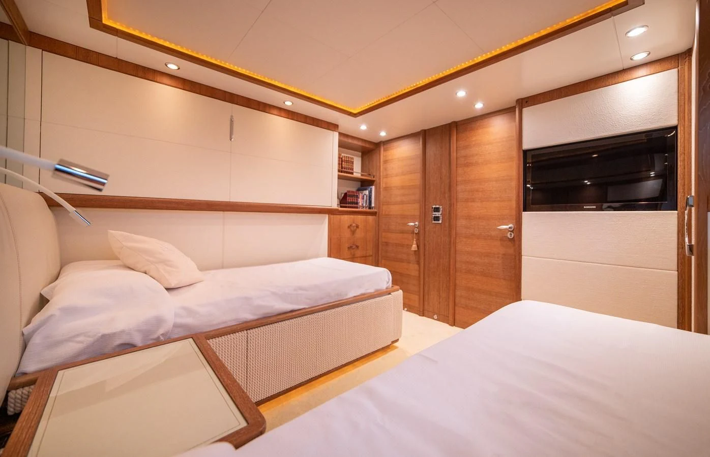 a room with a bed and a microwave aboard B TWO Yacht for Sale