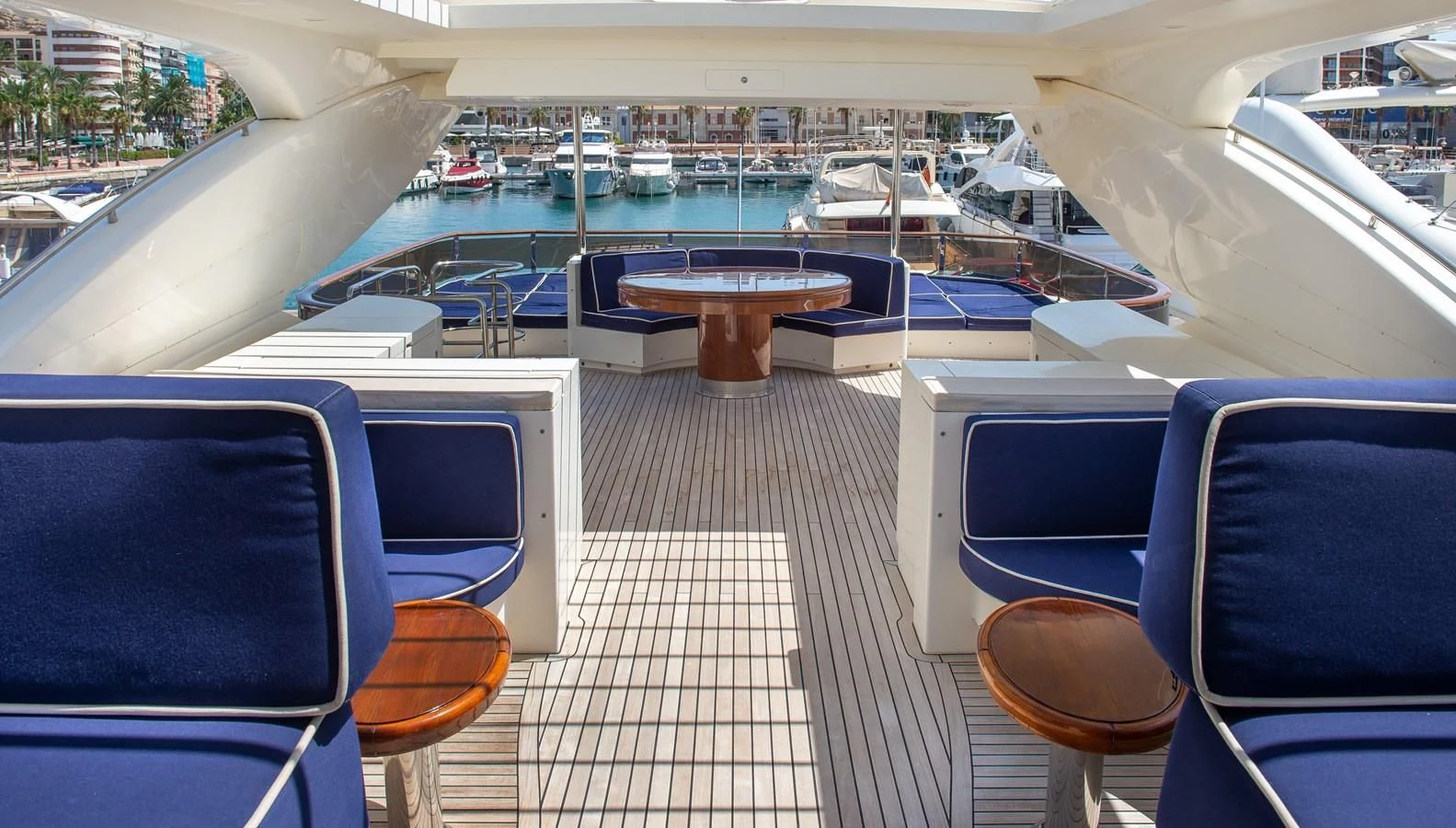 a room with a deck and chairs aboard B TWO Yacht for Sale