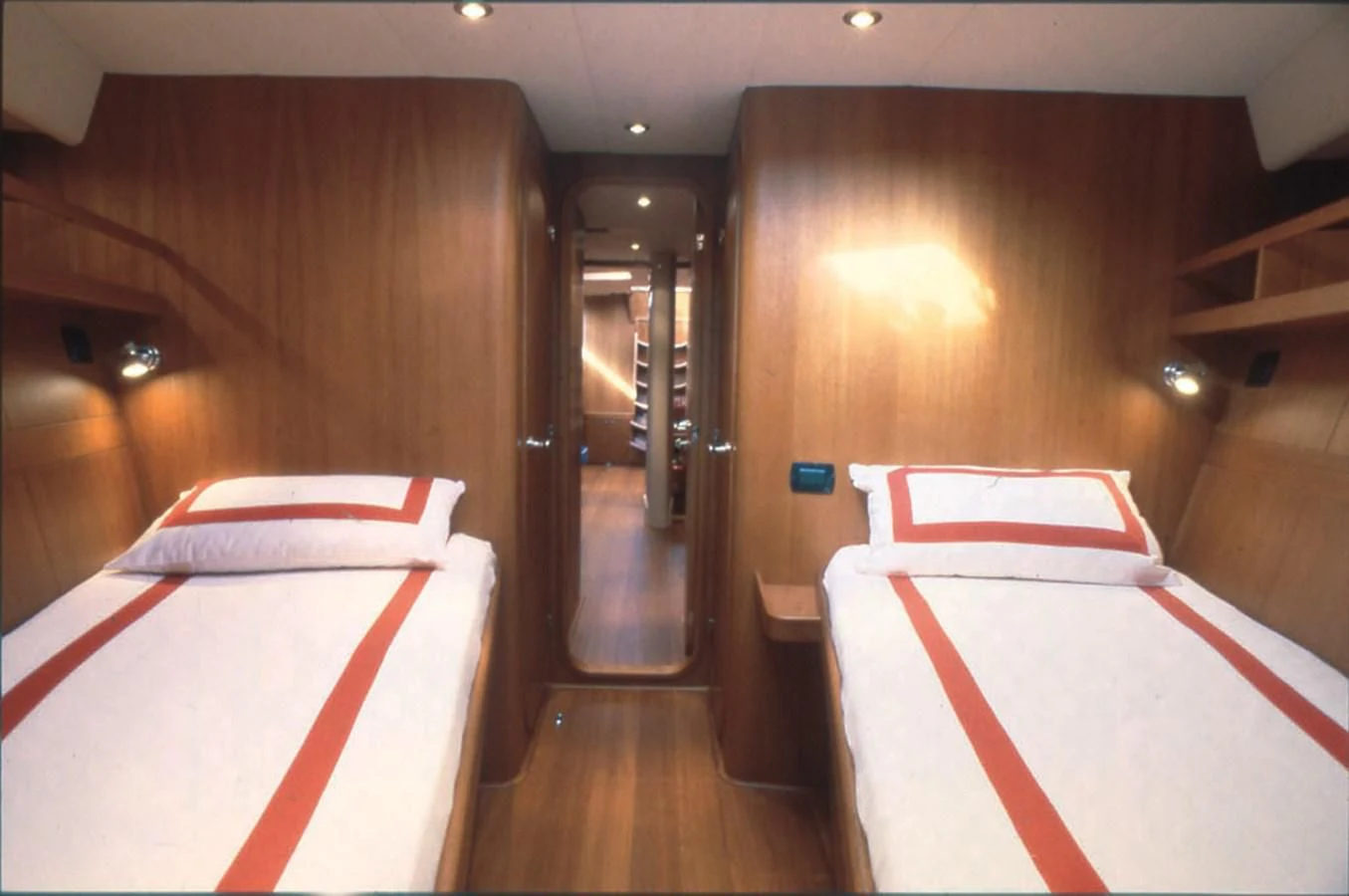 a room with a bed and a mirror aboard NAUTA-PETERSON 75 Yacht for Sale