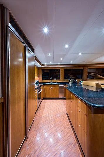 a kitchen with a large refrigerator aboard SLEEPOVER Yacht for Sale