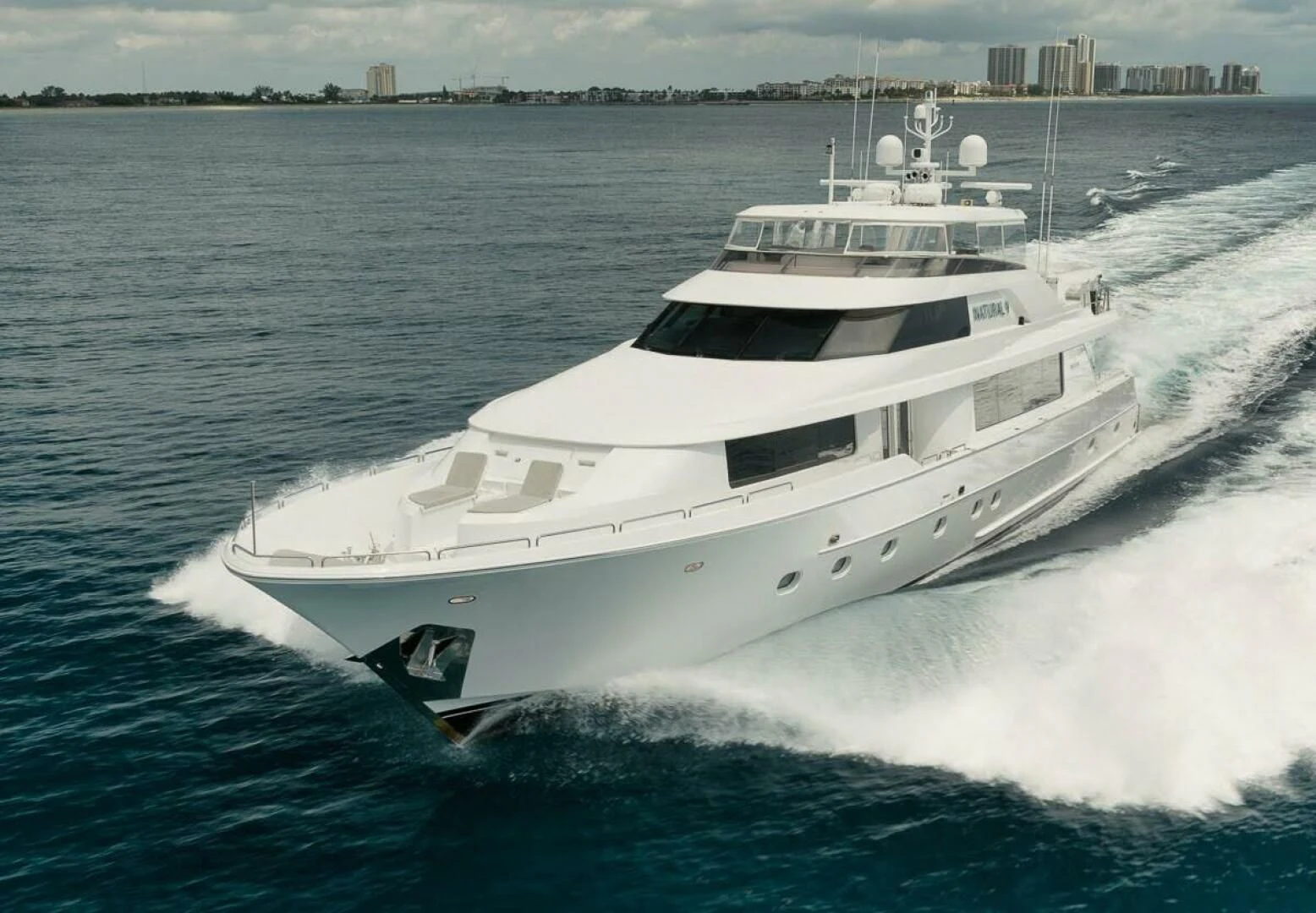 a white yacht on the water aboard SLEEPOVER Yacht for Sale