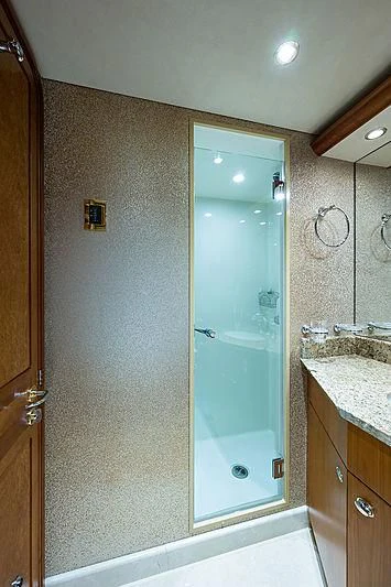 a bathroom with a glass shower aboard SLEEPOVER Yacht for Sale