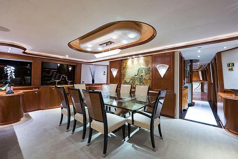 a dining room with a table and chairs aboard SLEEPOVER Yacht for Sale