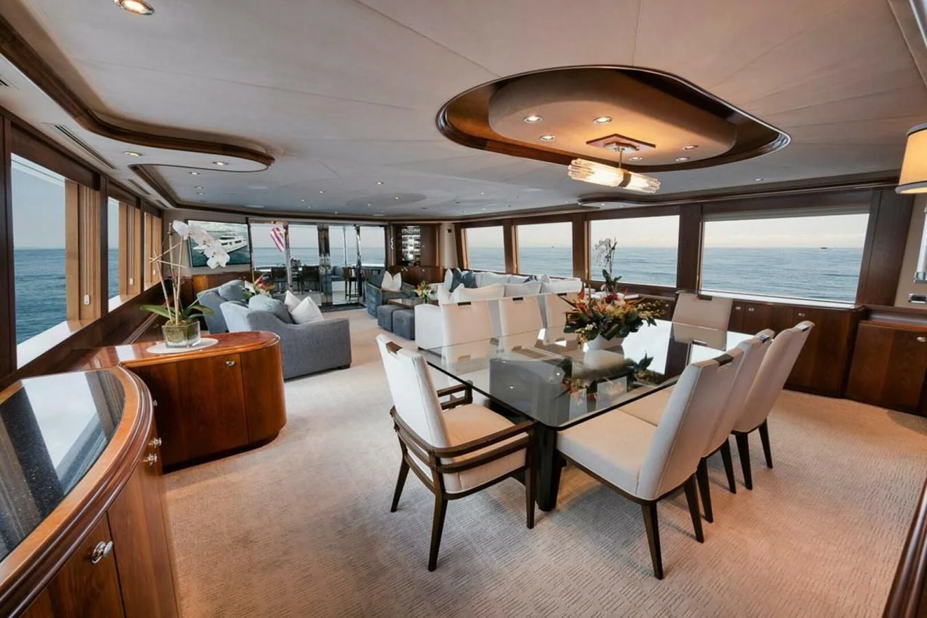 a room with a table chairs and a couch aboard SLEEPOVER Yacht for Sale