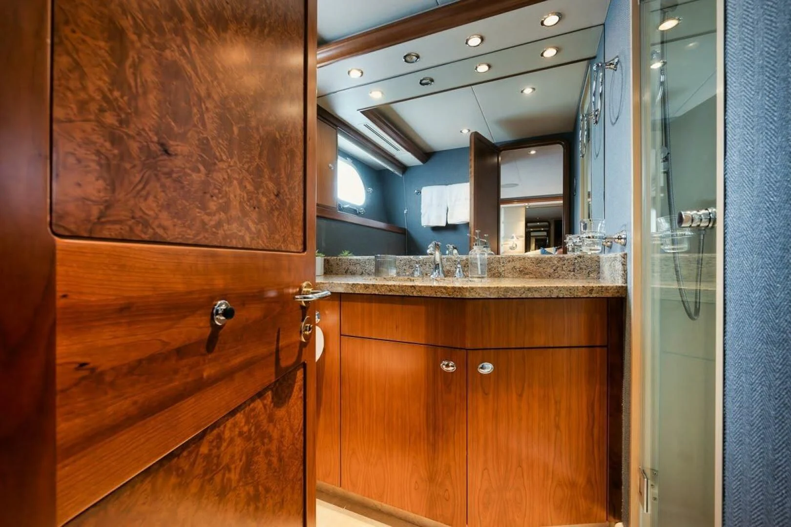 a bathroom with a countertop sink and cabinets aboard SLEEPOVER Yacht for Sale