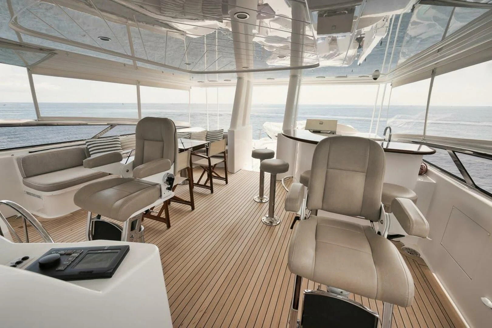 a boat with a desk and chairs aboard SLEEPOVER Yacht for Sale