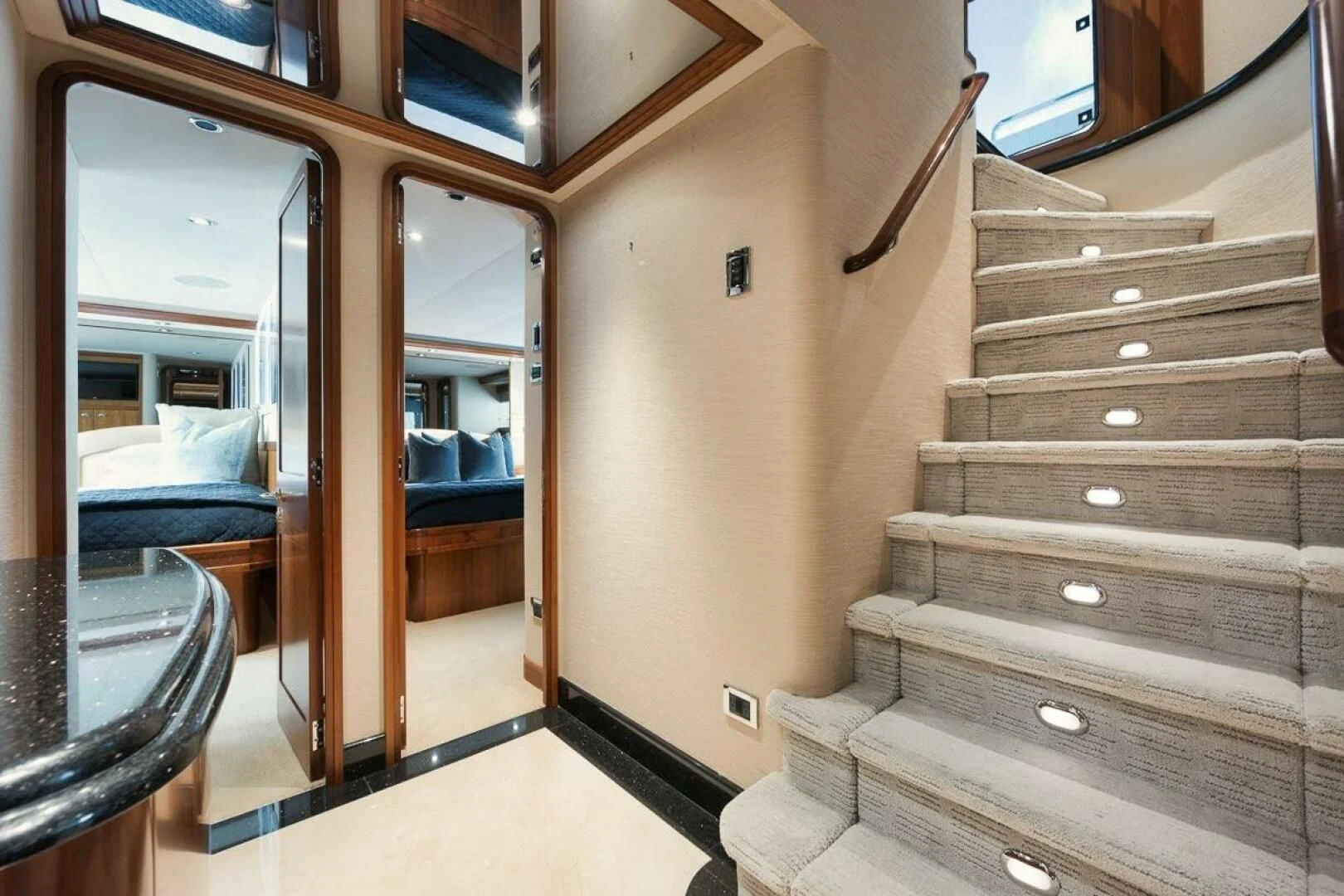 a wood staircase leading to a bedroom aboard SLEEPOVER Yacht for Sale