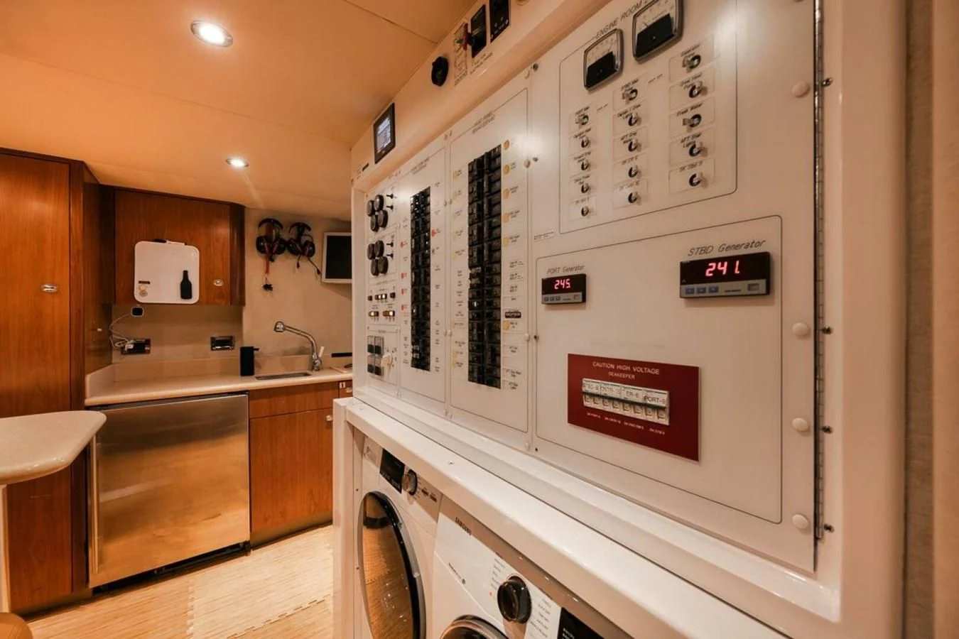 a kitchen with a large white stove aboard SLEEPOVER Yacht for Sale